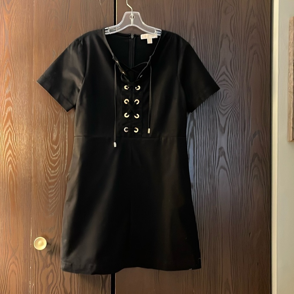 Michael Kors short sleeved black dress with lacing. Size 10.